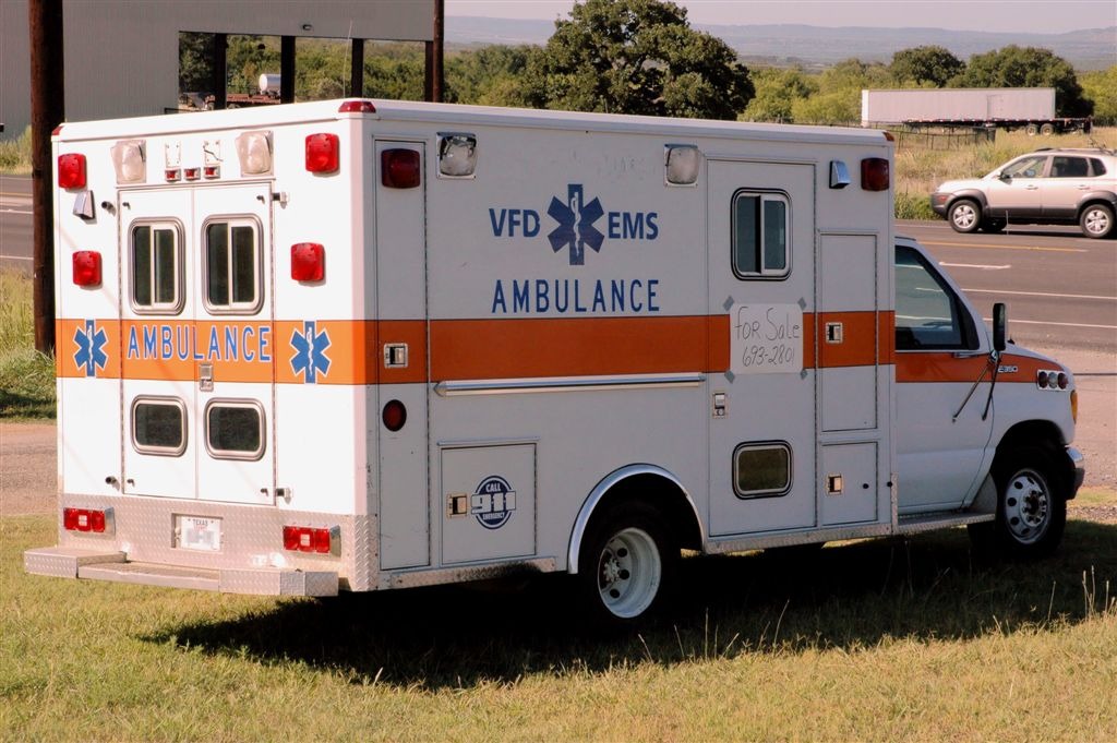 Ambulance parked outside a station