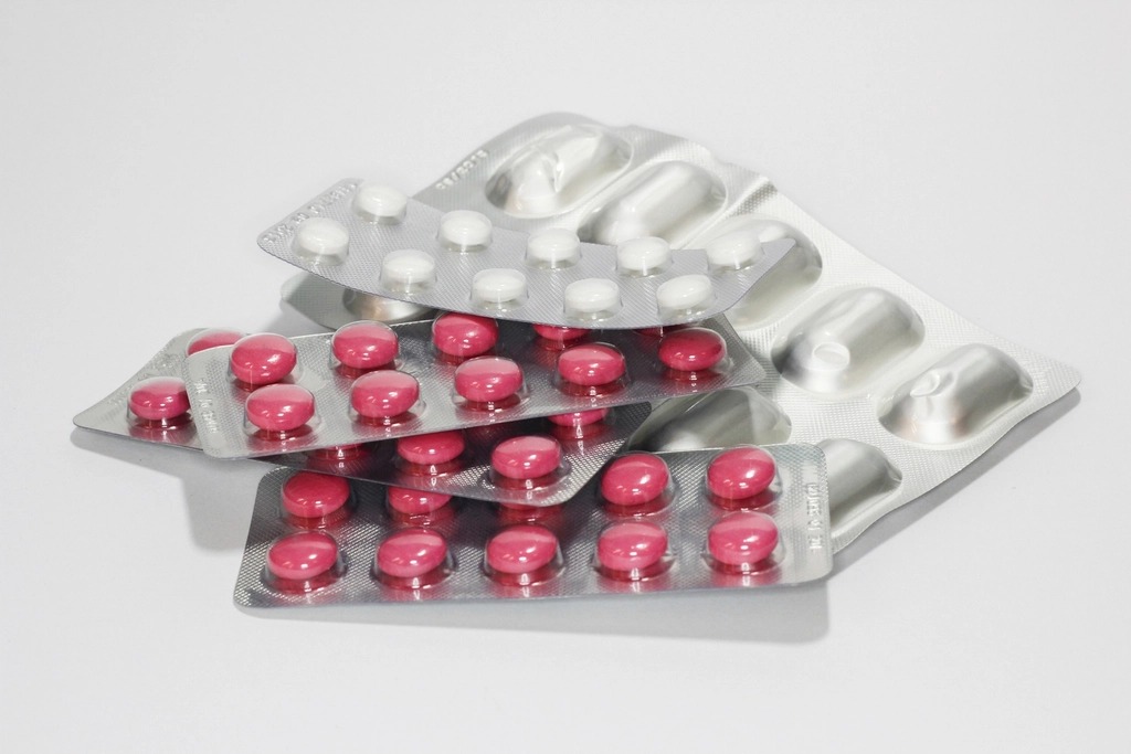 Blister packs of red and white capsules