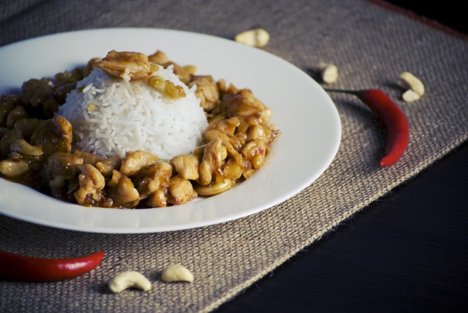 Plate of chicken and rice with cashews