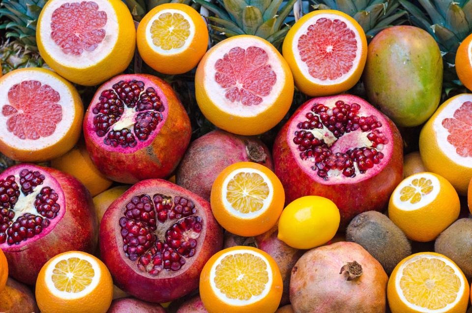 Colourful citrus fruit and pomegranates