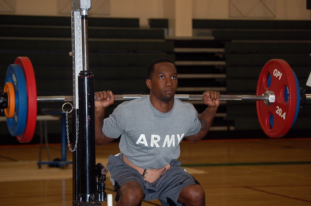 Lifter bracing under a heavy squat