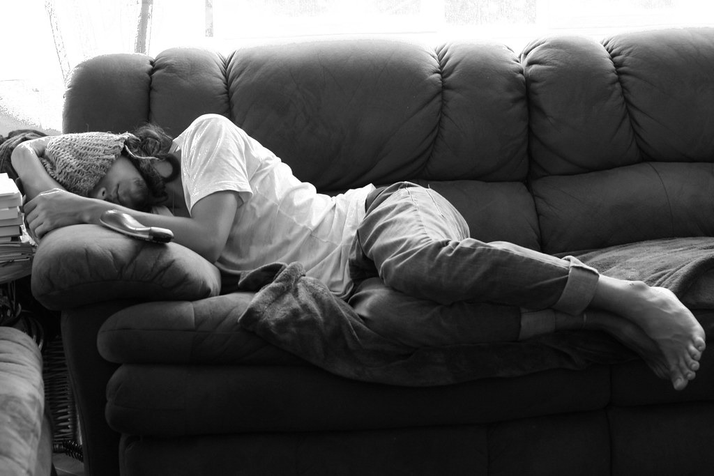 Man asleep on a couch