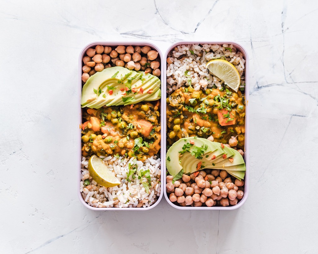 Meal prep containers with chickpeas and avocado