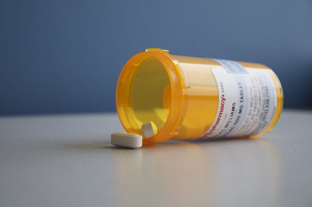 Prescription pill bottle on its side