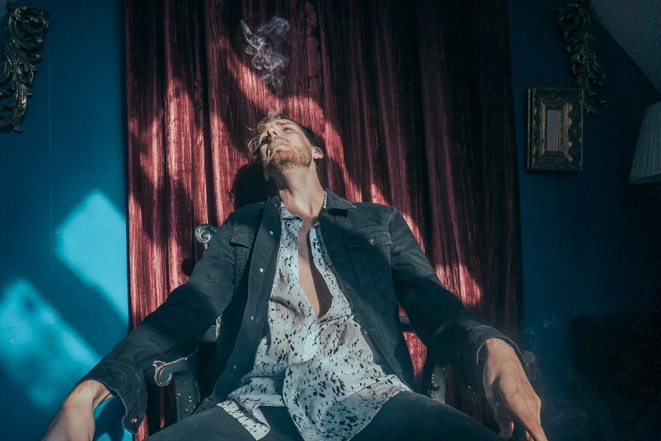 Tired man leaning back in a chair