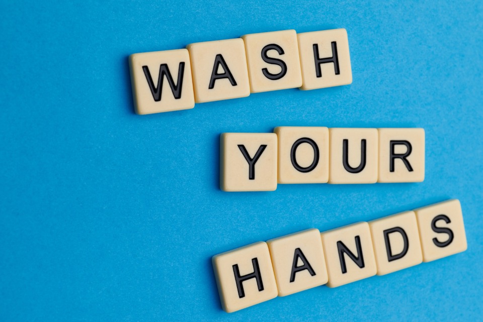 Letter tiles spelling wash your hands