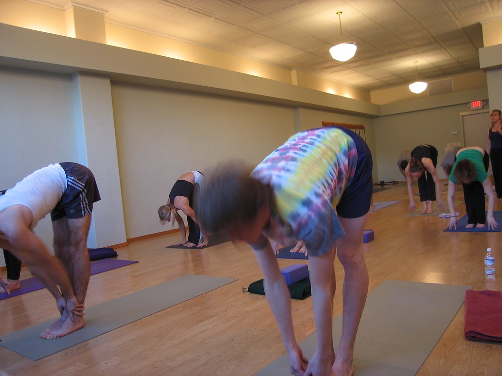 Yoga class stretching in a studio